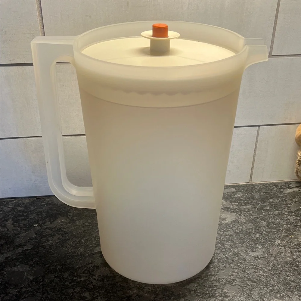 Vintage Tupperware One Gallon Translucent White Pitcher with Orange Lid.